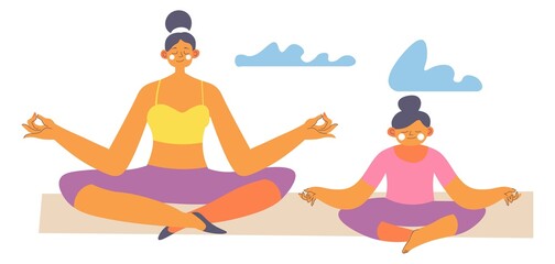 Mother and daughter meditating doing yoga asana