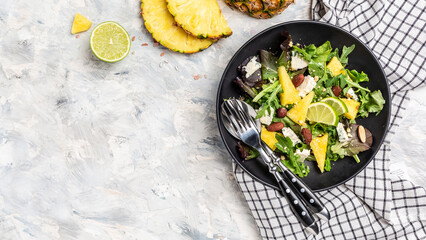 Tasty summer appetizing summer salad with nuts, blue cheese, and pineapple. Healthy juicy food. selection of healthy food