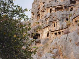 Fototapeta na wymiar Archeological remains of the Lycian rock cut tombs in Myra, city Demre in Turkey. unique ancient necropolis.