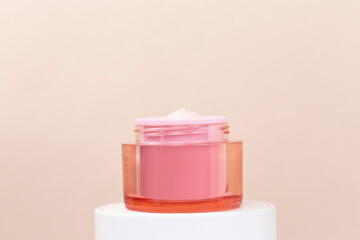 hand cream bottle on pink background