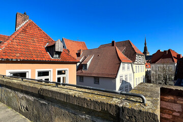 The roof tops in an old german town called Osnabrück. In the distance the famous Church Steeple of...