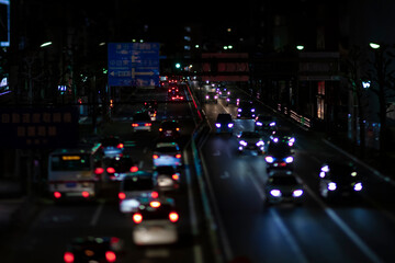 Fototapeta na wymiar A night miniature traffic jam at the city street in Tokyo