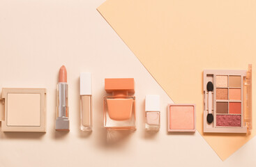 decorative cosmetics with perfume  on pastel  background