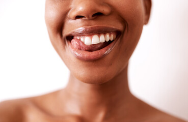 My teeth never looked this good. Closeup shot of a beautiful young woman posing with glossy lips against a white background.