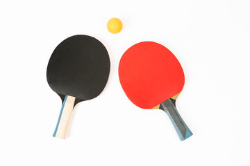 table tennis racket and ping pong balls on a white background