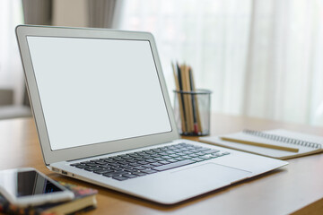 Working desk with laptop computer, document, paperwork, book and pencil it is arranged neatly.