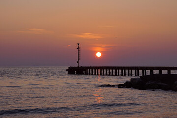 Fototapeta premium pier in the sunset at cinquale of montignoso in tuscany