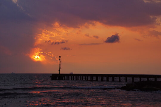 pier in the sunset at cinquale of montignoso in tuscany