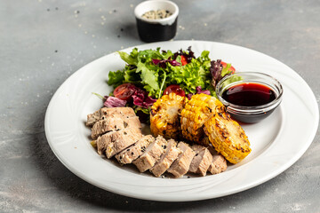 Green salad with chicken breast, grilled corn and sauce. Healthy fats, clean eating for weight loss