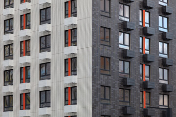 Two multi-colored walls of a modern building in white and gray