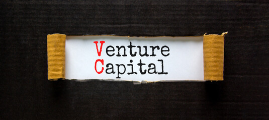 VC venture capital abbraviation symbol. Concept words VC venture capital on white paper. Beautiful black background. Copy space. Business and VC venture capital concept.