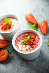 Homemade strawberry soup with chocolate and cream