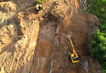 Excavator dig ground for sewerage and sanitary sewer. Excavator on earthworks for install of storm...