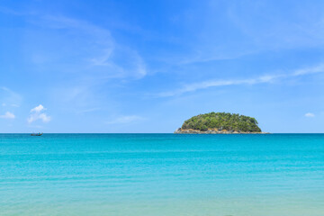 Tropical paradise island in turquoise clear blue sea. Kata Beach, famous tourist destination and resort area, Phuket, Thailand