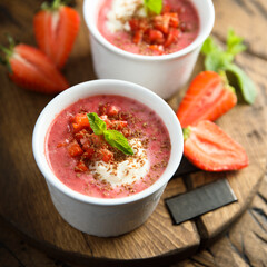 Homemade strawberry soup with chocolate and cream