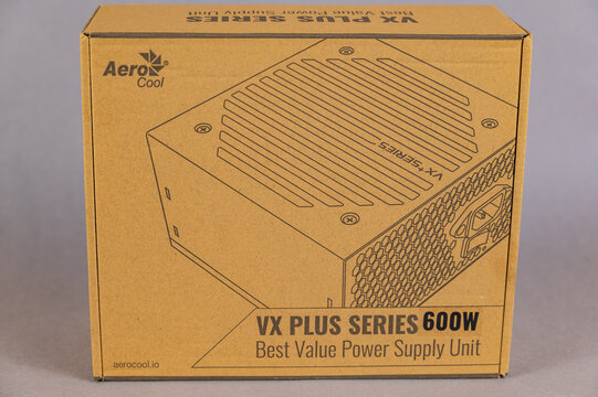 The new VX PLUS 600 aerocool desktop power supply. Brown cardboard box with accessories for a modern computer. Ukraine, Nikolaev - 02 09 2022