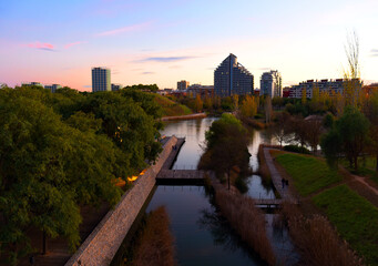 Turia river bed and gardens in the city park of the city of Valencia in Spain. View of the river from the bridge near the biopark.