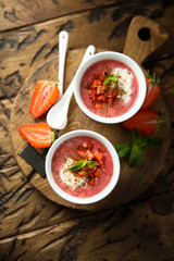 Homemade strawberry soup with chocolate and cream