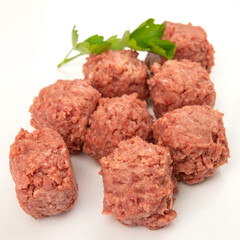 raw beef meatballs isolated on a white background