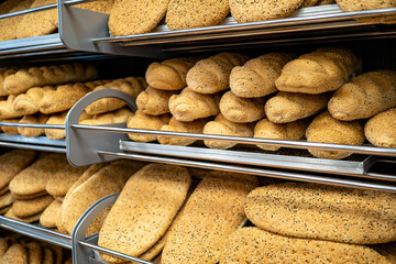 Freshly baked bread is on the counter in the bakery. The concept of bakery products, the shortage...