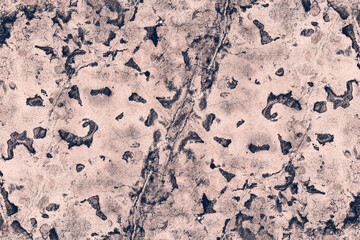 Grungy dark stone wall surface with stain and spots for texture background