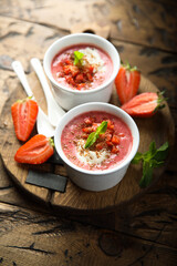 Homemade strawberry soup with chocolate and cream