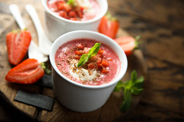 Homemade strawberry soup with chocolate and cream