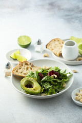 Healthy green salad with avocado