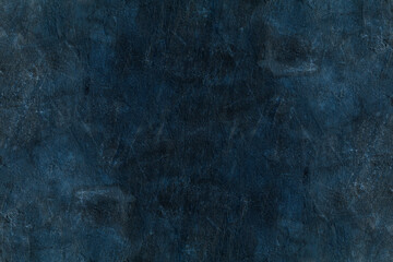 Dark blue aged stone wall surface with rough plaster texture