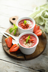 Homemade strawberry soup with chocolate and cream