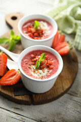 Homemade strawberry soup with chocolate and cream