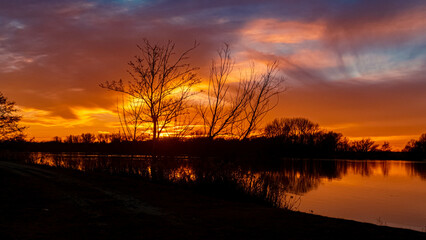 Beautiful sunset with reflections near Plattling, Isar, Bavaria, Germany