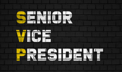 Senior vice president (SVP) concept,business abbreviations on black wall 