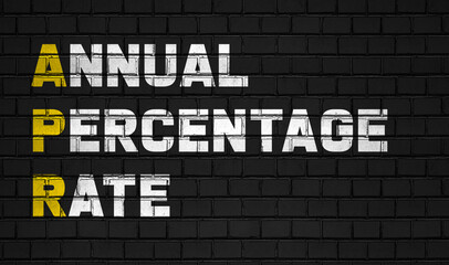 Annual percentage rate (APR) concept,business abbreviations on black wall 