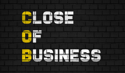 Fototapeta na wymiar Close of business (COB) concept,business abbreviations on black wall 