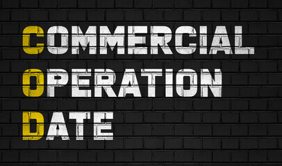 Fototapeta na wymiar Commercial operation data (COD) concept,business abbreviations on black wall 