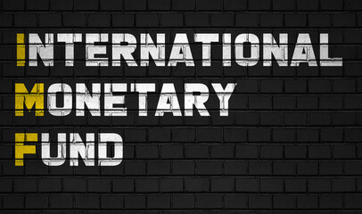 International monetary fund (IMF) concept,business abbreviations on black wall 
