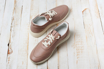 Light brown faux leather shoes with laces. Close-up shot.