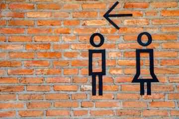 Female and Male restroom. signl on red brick wall  background. Toilet icon, Restroom Concept,