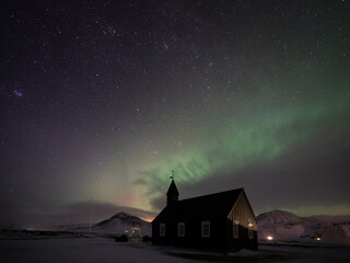 Northern Lights, Aurora Borealis over the Black Church at Búðir, Snæfellsnes Peninsula, West Iceland.