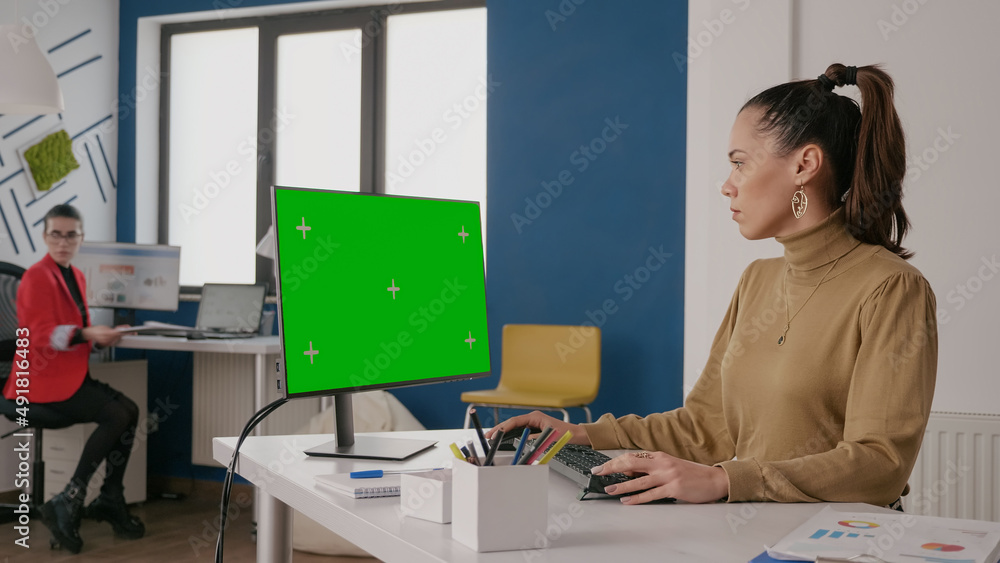 Poster business woman looking at green screen on computer, using isolated template and chroma key mock up t