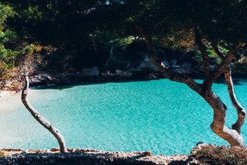 Beautiful beach with azure waters in the Spanish island of Mallorca or Palma de Majorca in the...