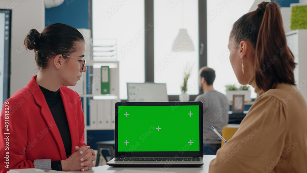 Poster business people doing teamwork with green screen on laptop, using isolated chroma key and mock up te