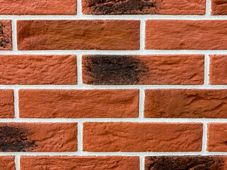 Red brick wall with close-up blur