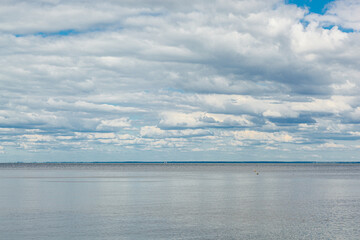 beautiful landscape of the sea against the background of a blue sky with clouds