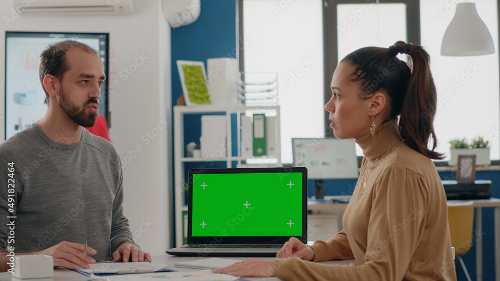 Aufkleber business people doing teamwork on laptop with green screen at desk. team of man and woman working wi