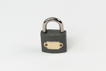 Solid padlock isolated on white background, grey steel locked padlock, solid security front view, selective focus