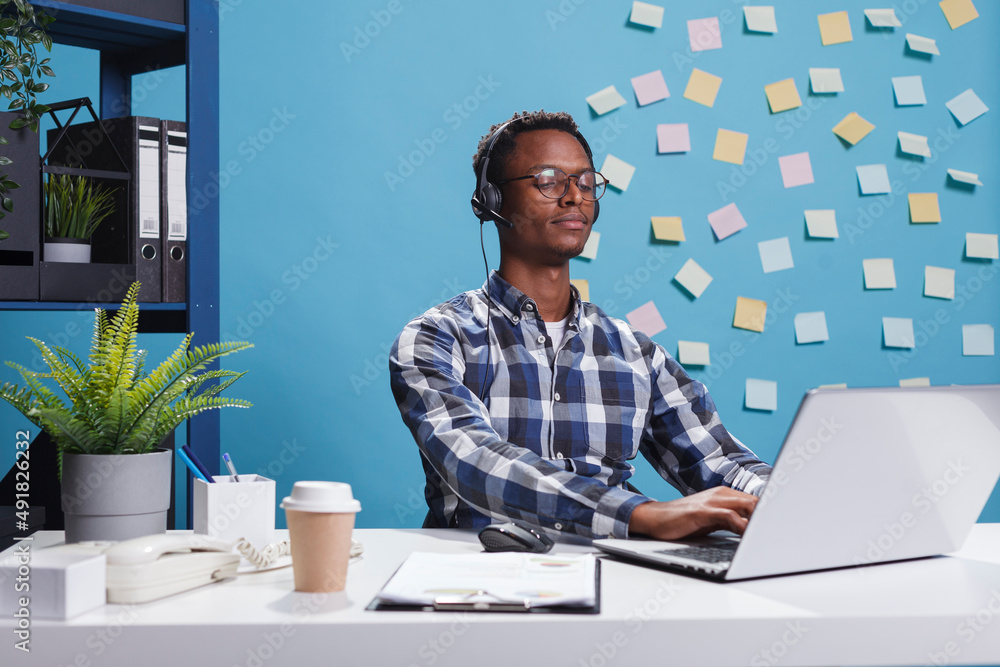 Poster customer support agent on call with company client while using work laptop to verify contact informa