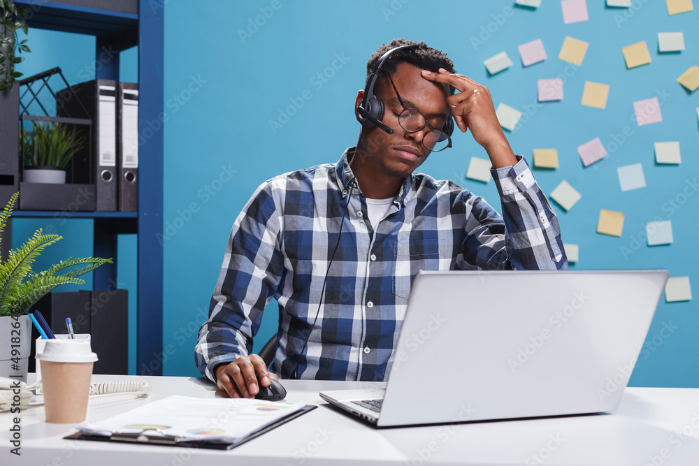 Poster exasperated and tired telemarketing consultant with painful headache thinking about client problem s