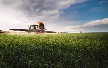 Farmer with tractor seeding